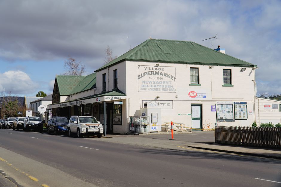 Historic village store on a sunny day in Richmond, Tasmania, showcasing traditional architecture.